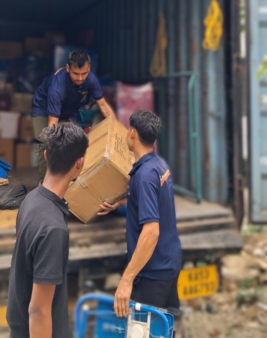 GoSmart Movers Team Packing and loading household goods into the truck
